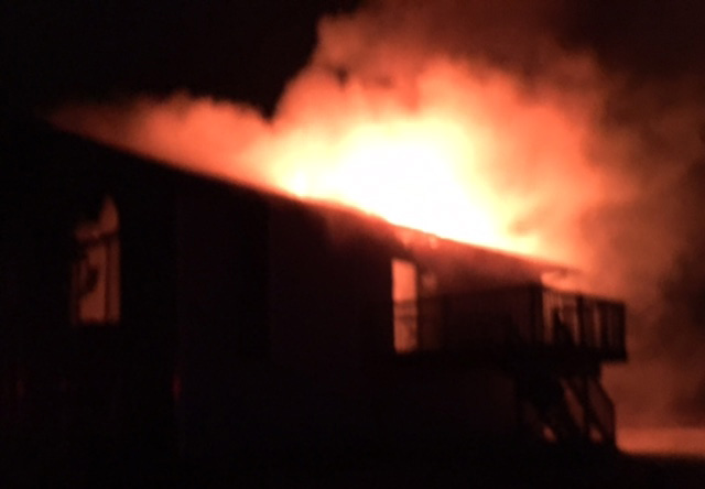 Firefighters battle house fire in town of Merrill
