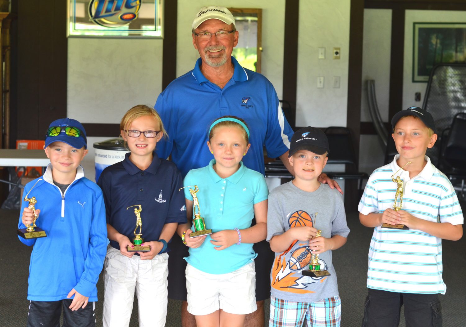 Children hit the links at Merrill Golf Course