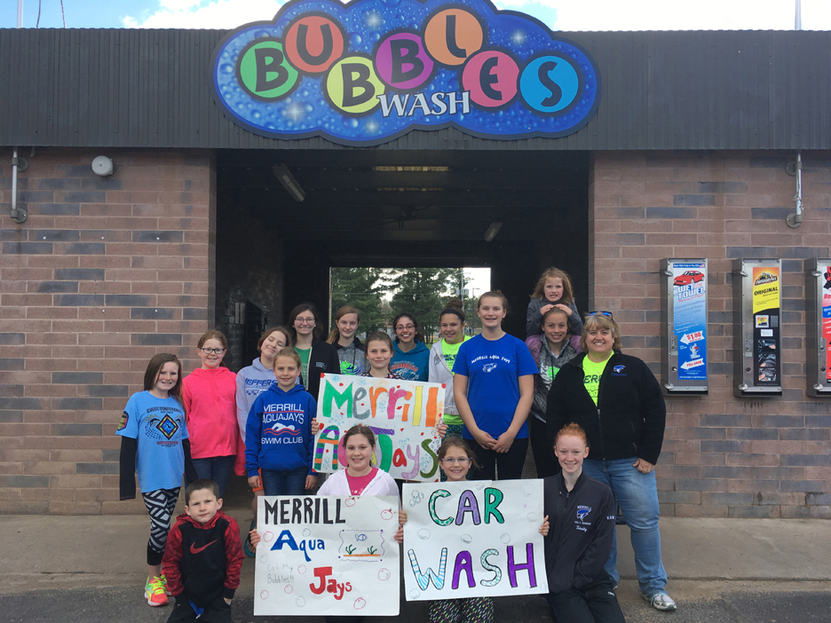 Swim club car wash raises funds for summer swim meet