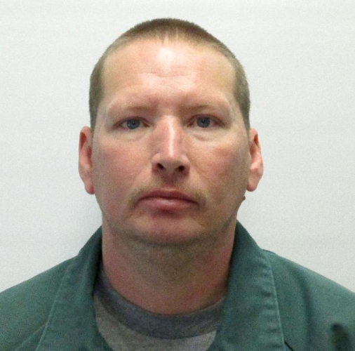 Escaped prison inmate remains at large