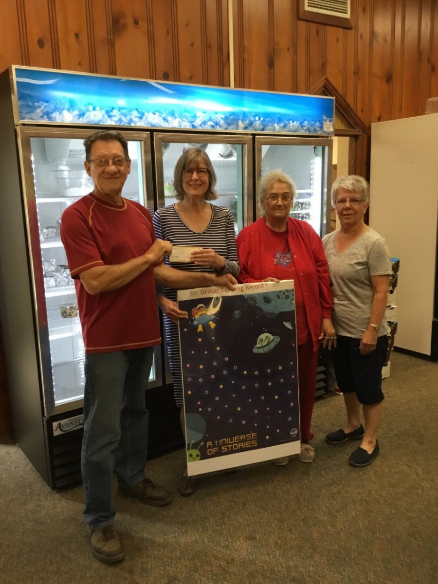 T.B Scott Library donates to the Community Food Pantry