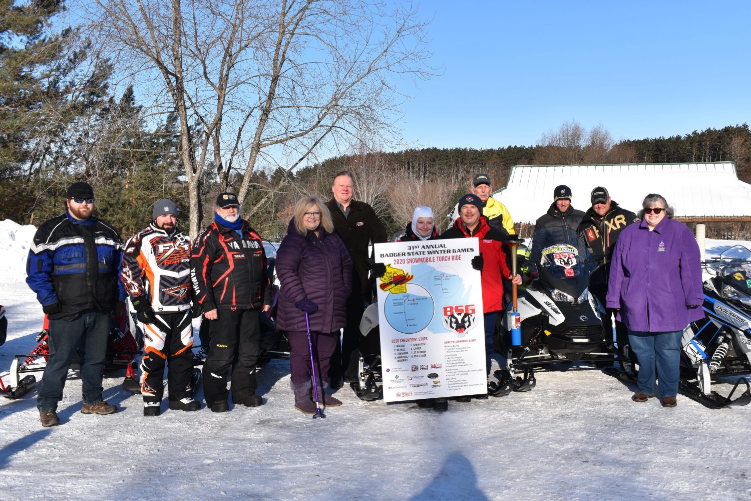 Badger State Winter Games Snowmobile Torch Ride makes stop in Merrill