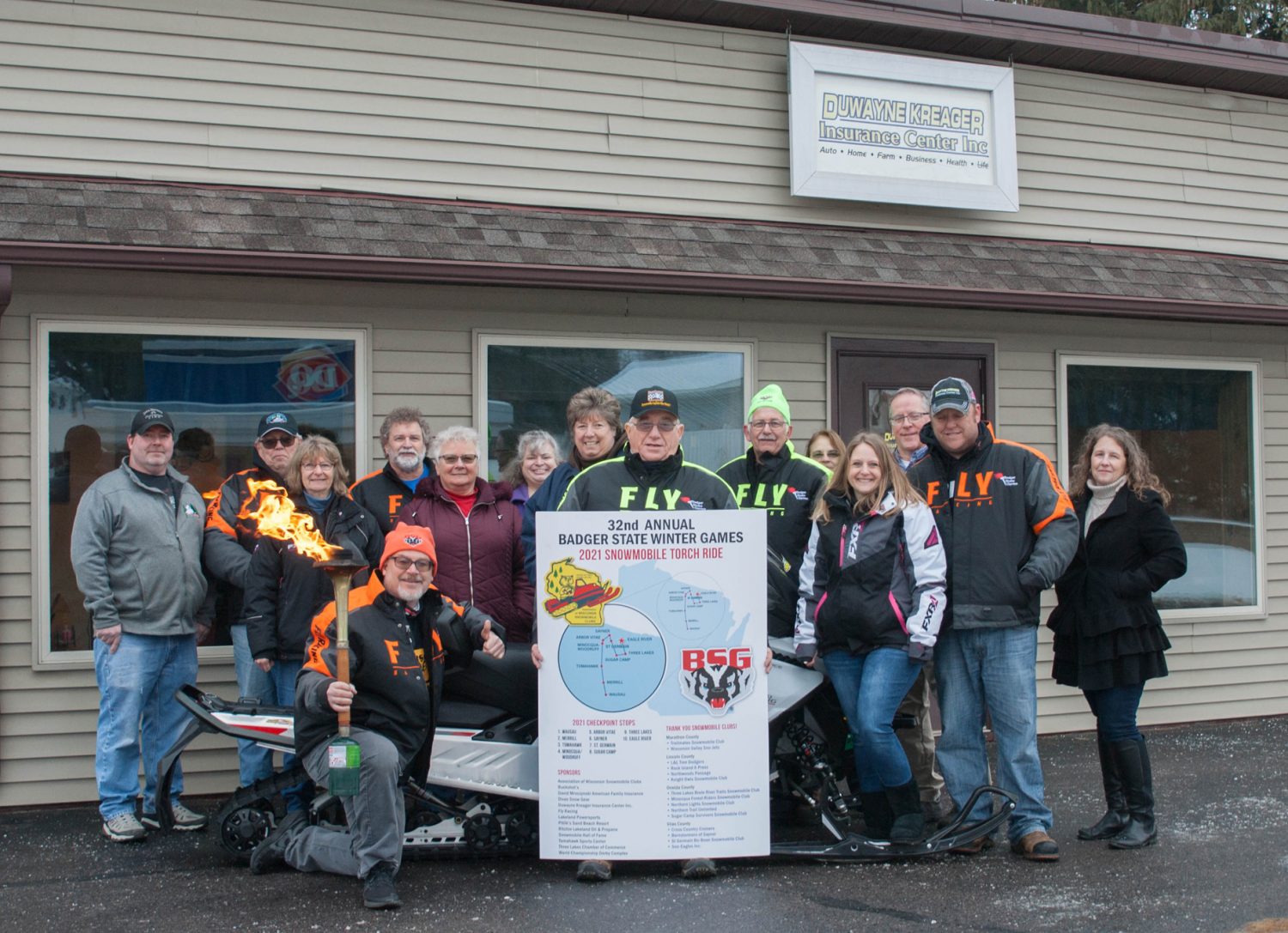 Badger State Games snowmobile torch ride stops in Merrill