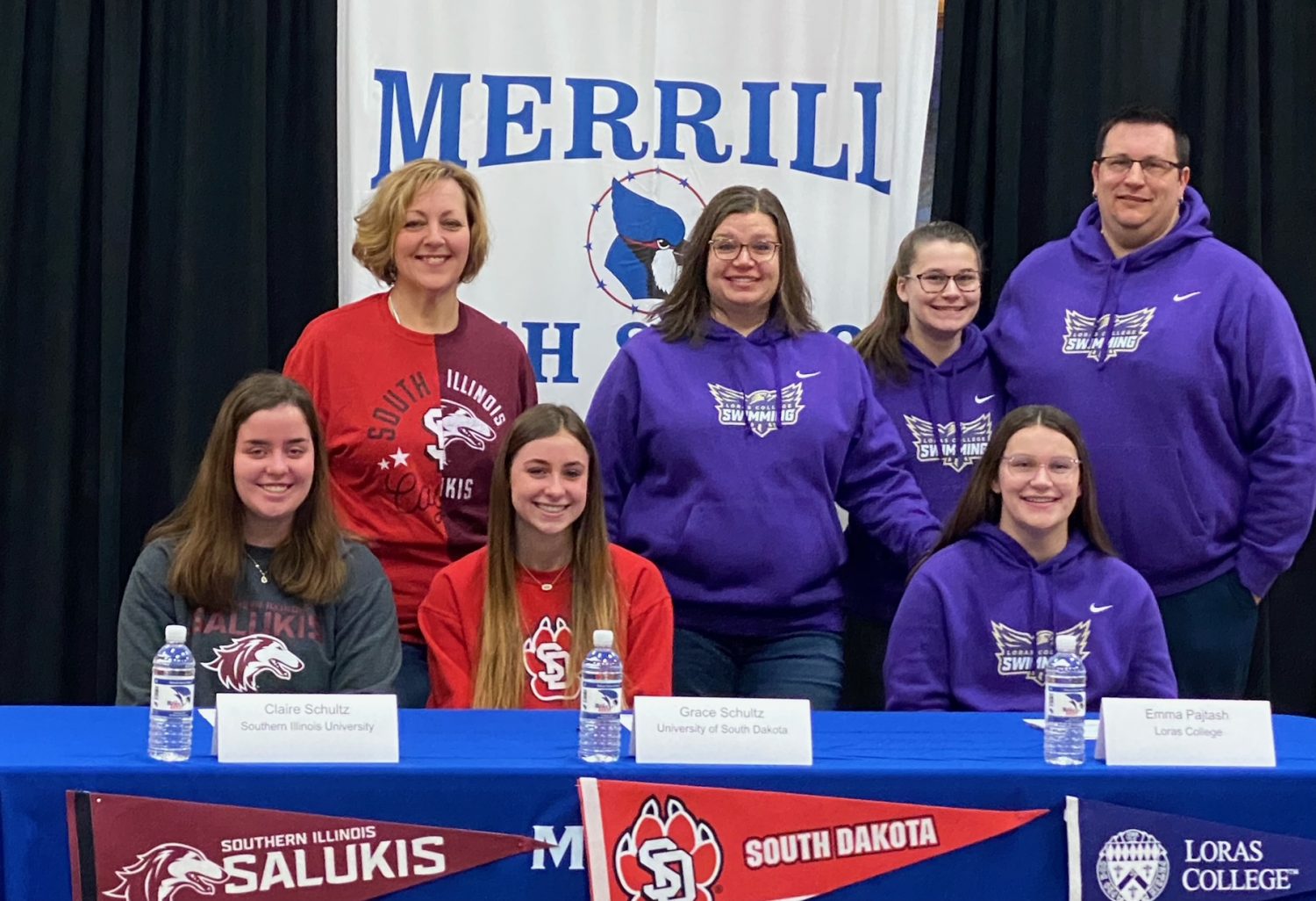 Three Merrill Varsity Girls Swimming teammates sign to compete at college level