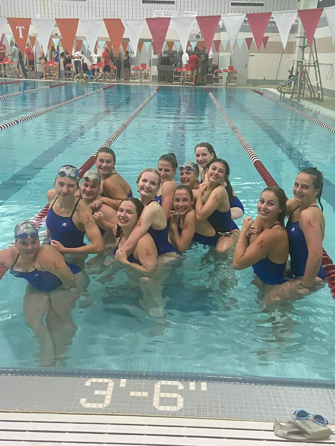 Lady Jays and Wausau East swimmers show support for kids impacted by childhood cancer