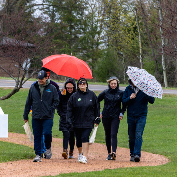 Raise Your Voice Mental Health Awareness Walk walkers brave the rain